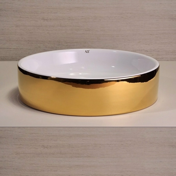 Bolleservant i gull vakker design for benkeplate